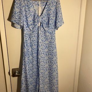 Maxi dress with peekaboo at top.